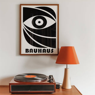 Black Eye Poster framed print with an abstract eye in black and white above a turntable and orange lamp