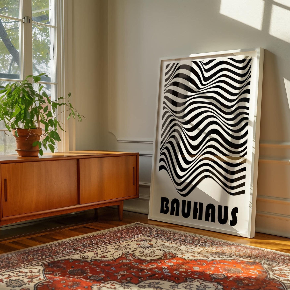 Graphic Art Print leaning on a wooden sideboard with wavy black and white stripes in a sunlit room