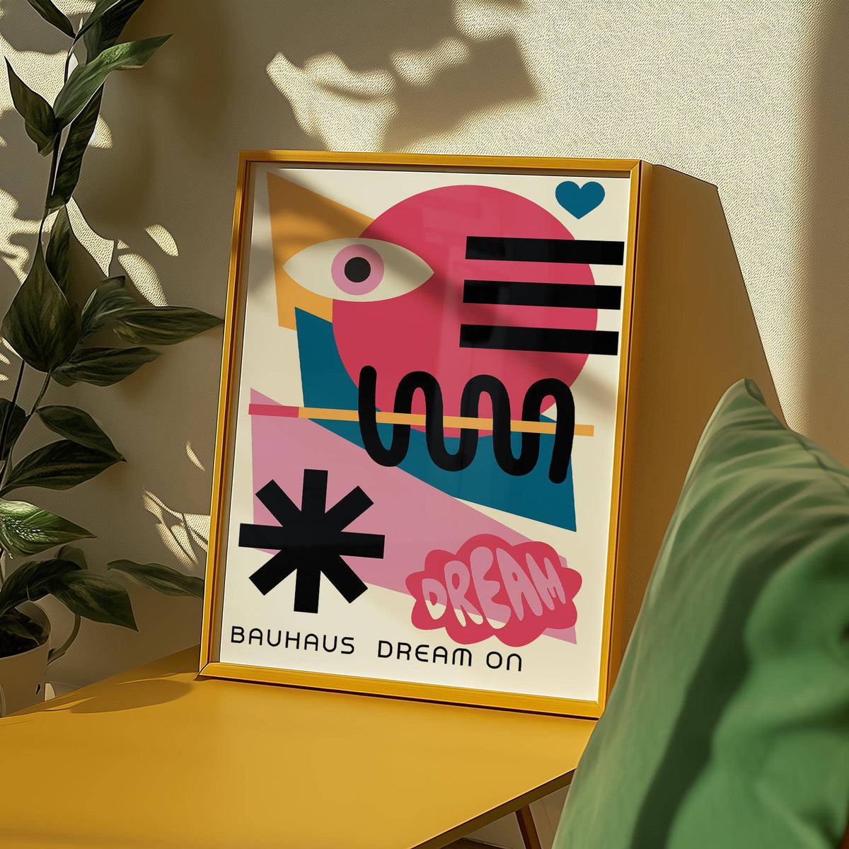 Maximalist Wall Art with an abstract eye and geometric shapes leaning on a yellow surface near a green cushion
