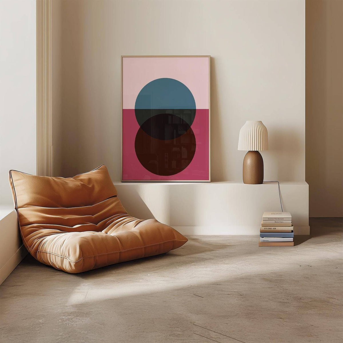 Purple wall art with overlapping blue and brown circles resting on a white ledge near a brown lamp and books in a living room