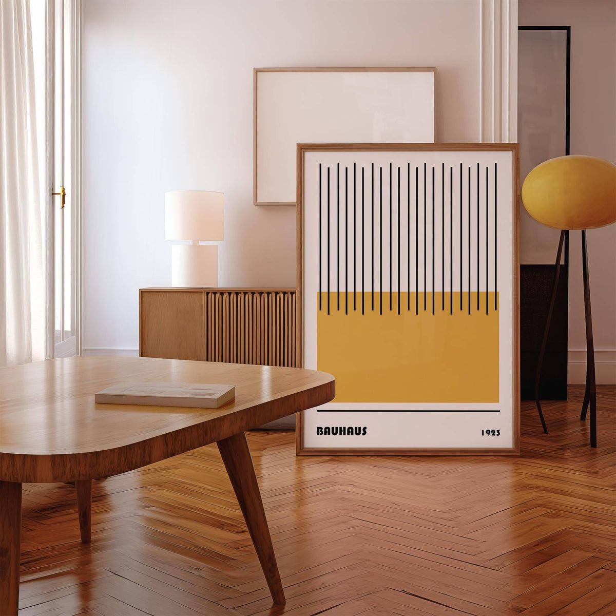 Modern Geometric Art print leaning on wooden floor with parquet and yellow floor lamp nearby