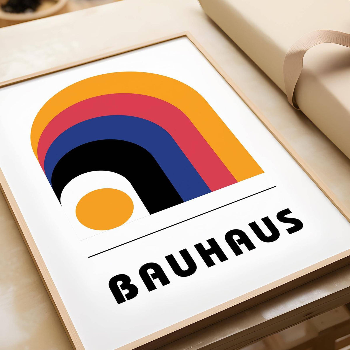 Framed Bauhaus Art Posters print with colourful arches on a white background beside brown wrapping paper