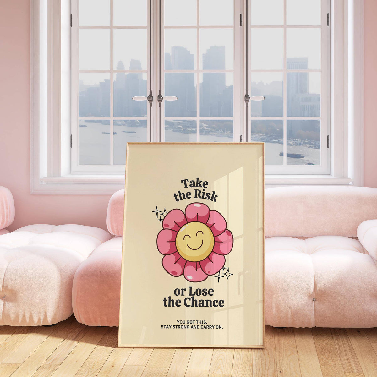 Motivational Quotes wall art with a smiling pink flower leaning on a cushion by a large window