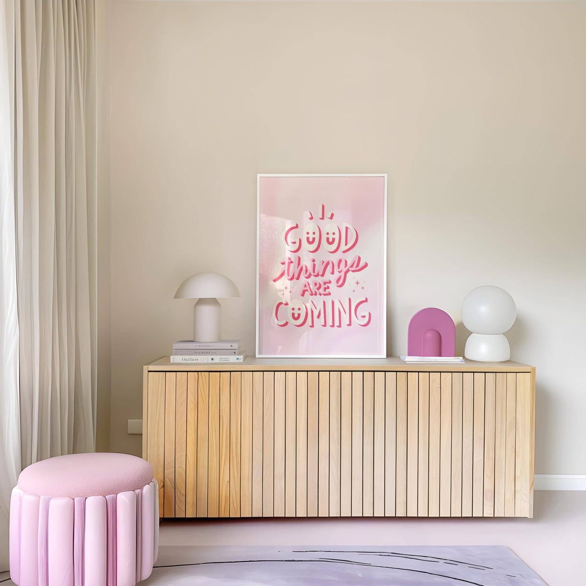 Motivational Posters for Students print with pink and white typography on a sideboard with lamps and a pink pouffe