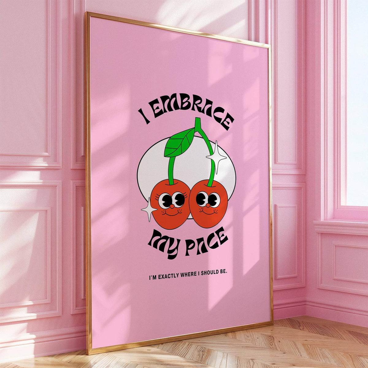 Wall Art for Dorm framed print of a pair of cherries with black text on pink background leaning on a wooden floor