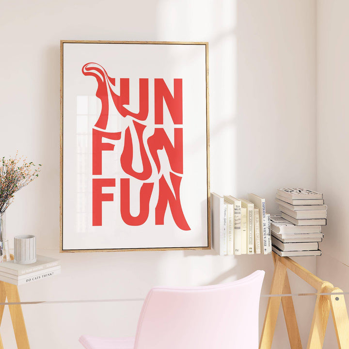 Wall art for teenage girl bedroom with red fun typography on a white background leaning on a shelf near books