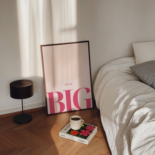 Encouraging Posters for Students leaning print with pink typography beside a low lamp and a bed