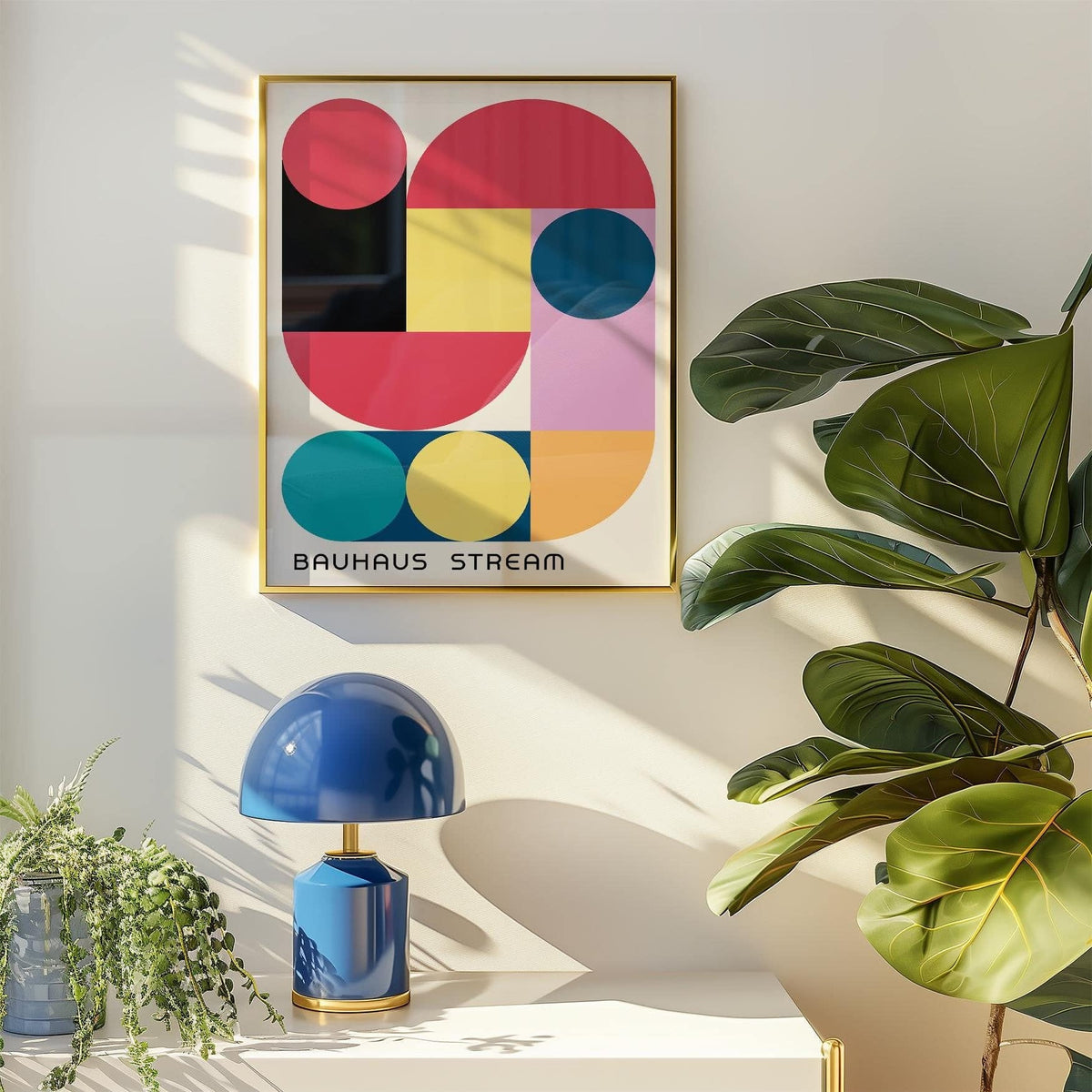 Large Colourful Wall Art with abstract geometric shapes in red, yellow and blue above a white table with a blue lamp and plants