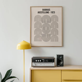 Bauhaus Minimalism Art framed print of black line arches above a yellow sideboard with a speaker and record player