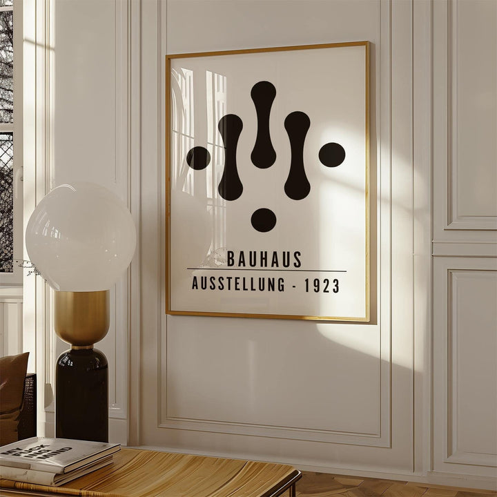Framed Bauhaus Art Black and White print with abstract shapes in a sunlit room next to a lamp
