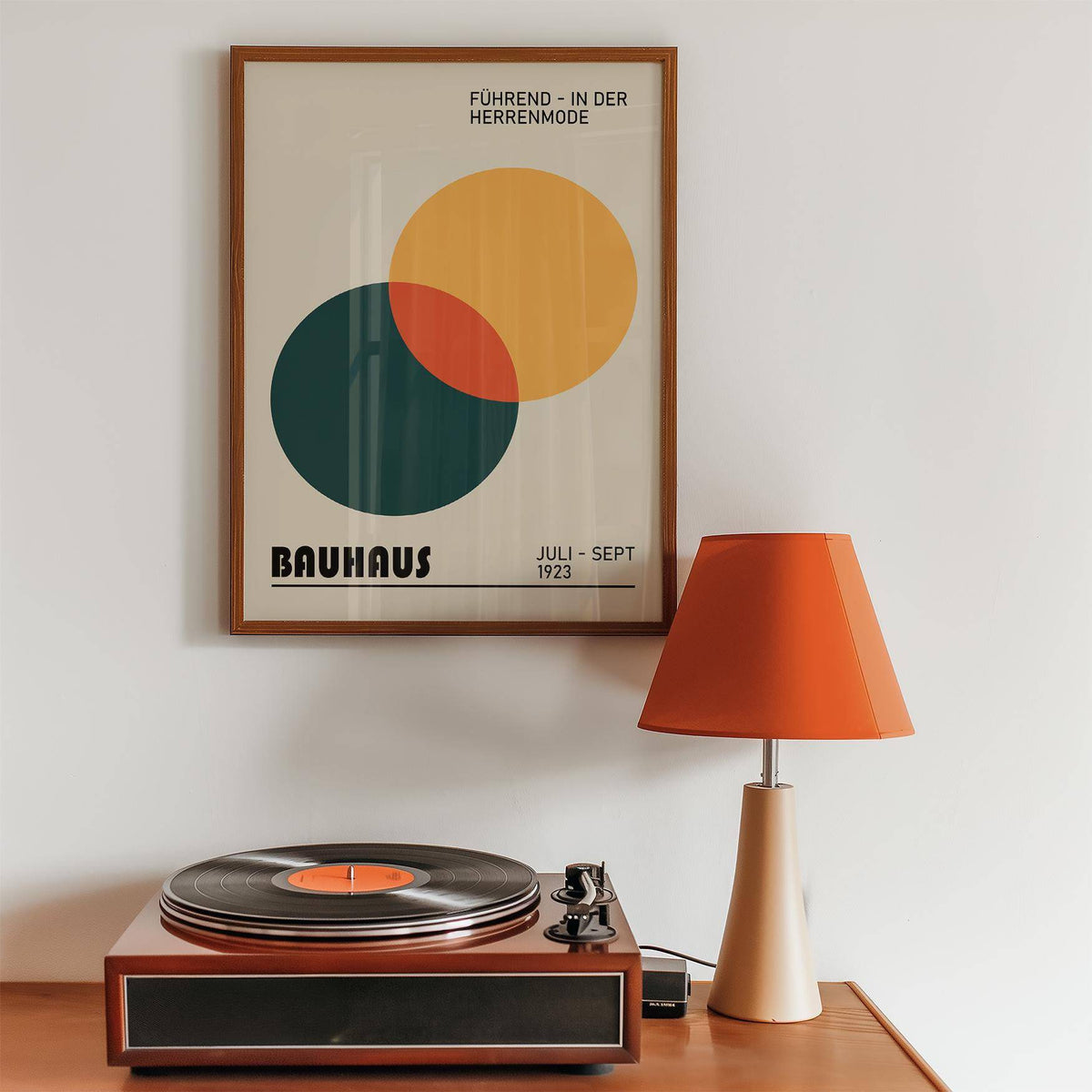 Print geometric framed print of overlapping circles in orange and green with a record player and lamp