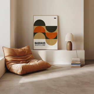 Artwork for the Wall leaning on a white ledge with geometric shapes in earthy tones and a lamp beside it
