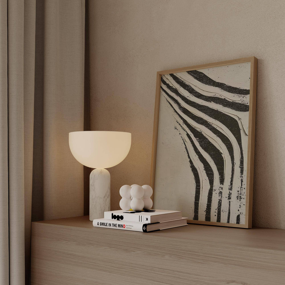 Big Abstract Art leaning print of black and white zebra stripes on a wooden shelf with a lamp and books