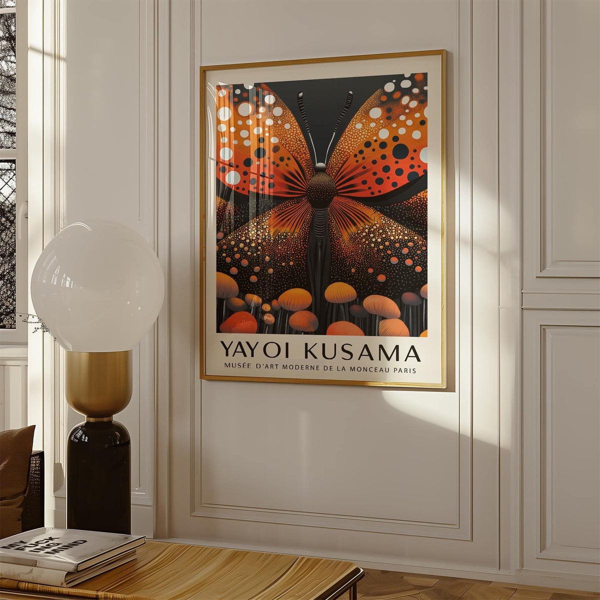 Abstract Butterfly Art framed print with an orange butterfly and black background in a white room next to a lamp