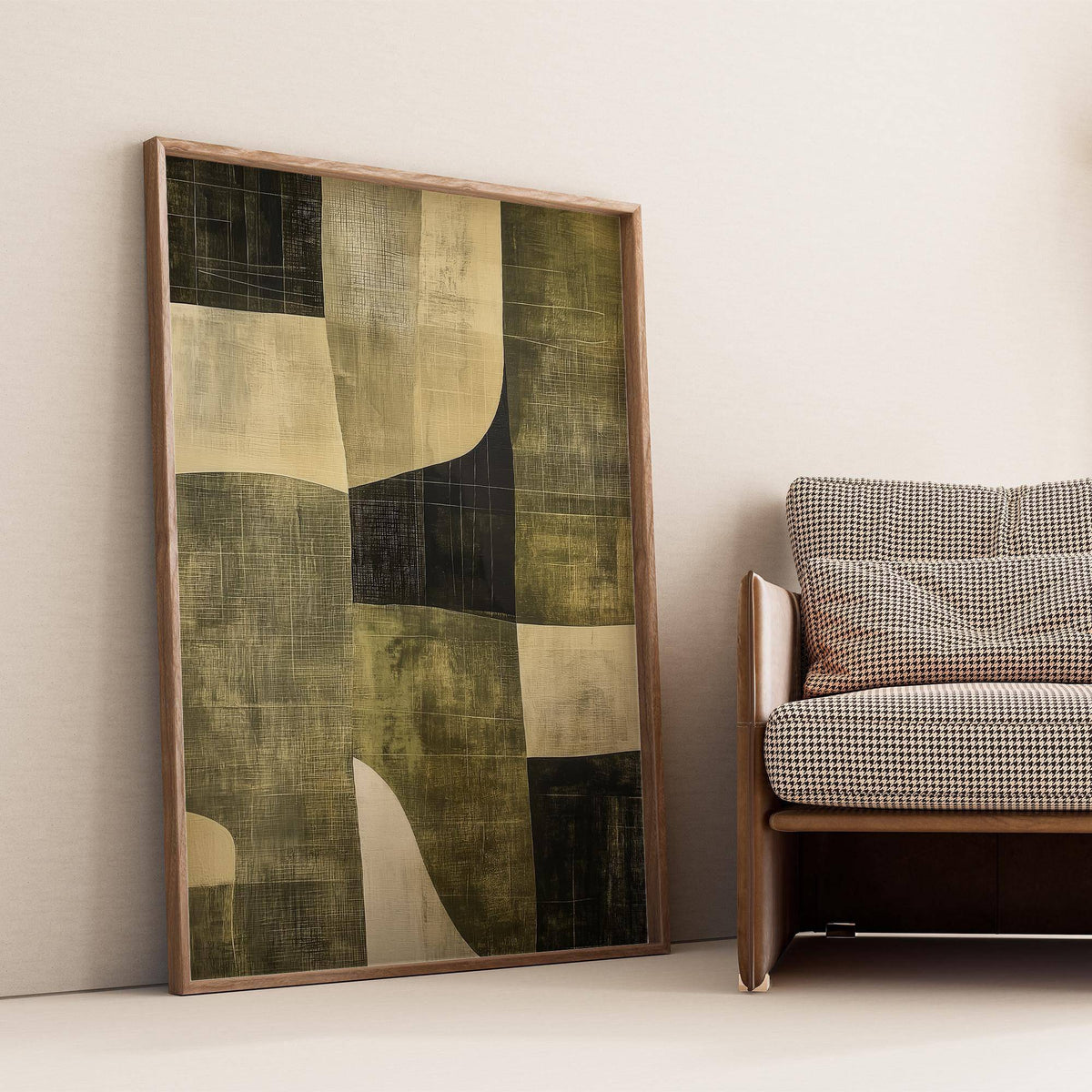 Wabi Sabi Green wall art leaning by a brown armchair in muted olive and cream tones