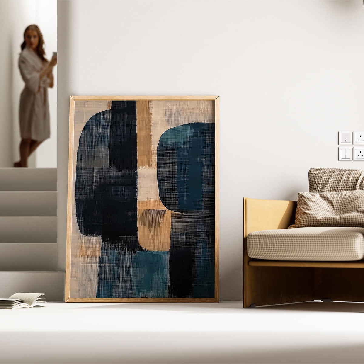 Wabi Sabi Painting leaning on a floor with abstract shapes in blue and beige near a sofa and steps