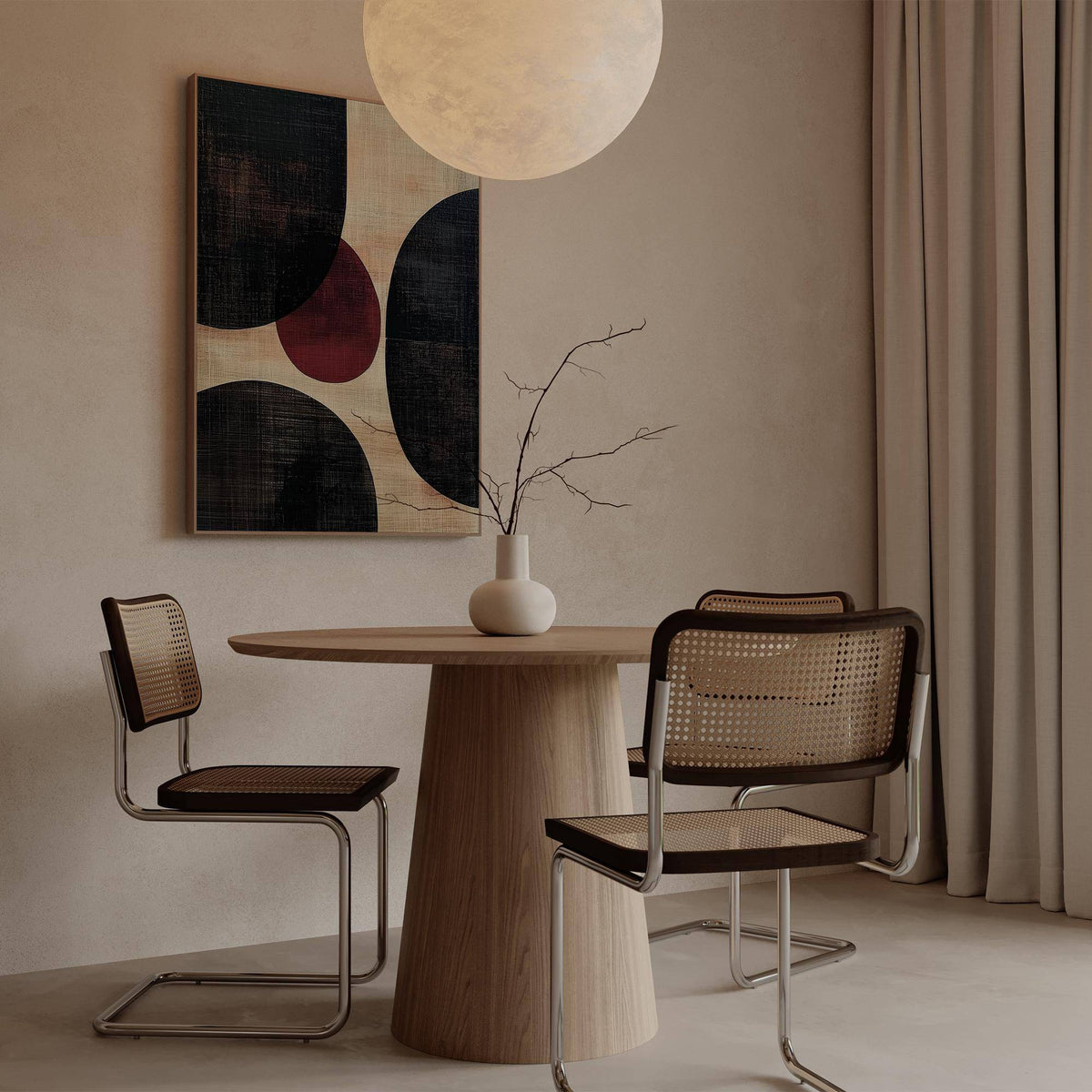 Wall Art Abstract featuring rounded shapes in black and maroon above a wooden table with two chairs