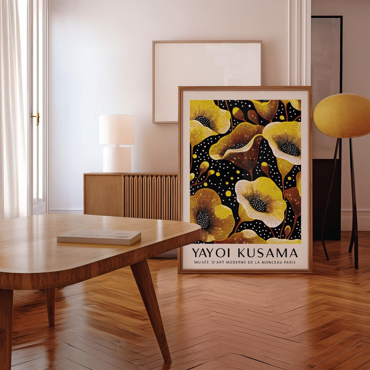 Print leaning on a wooden floor with yellow poppy flowers and text below in a modern room