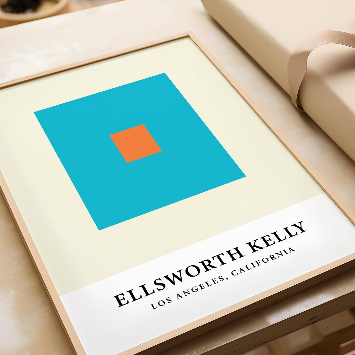 Wall Office Art showing blue and orange squares in a minimalist style next to a rolled gift wrap