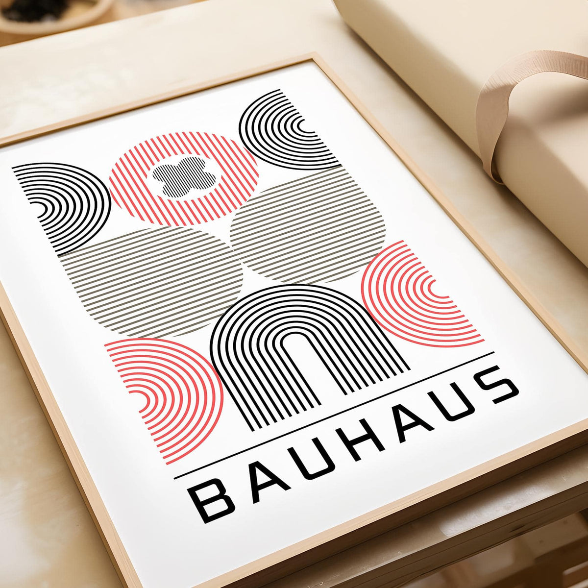 Wall art for Home Office with abstract geometric shapes in black beige and red near gift wrapping