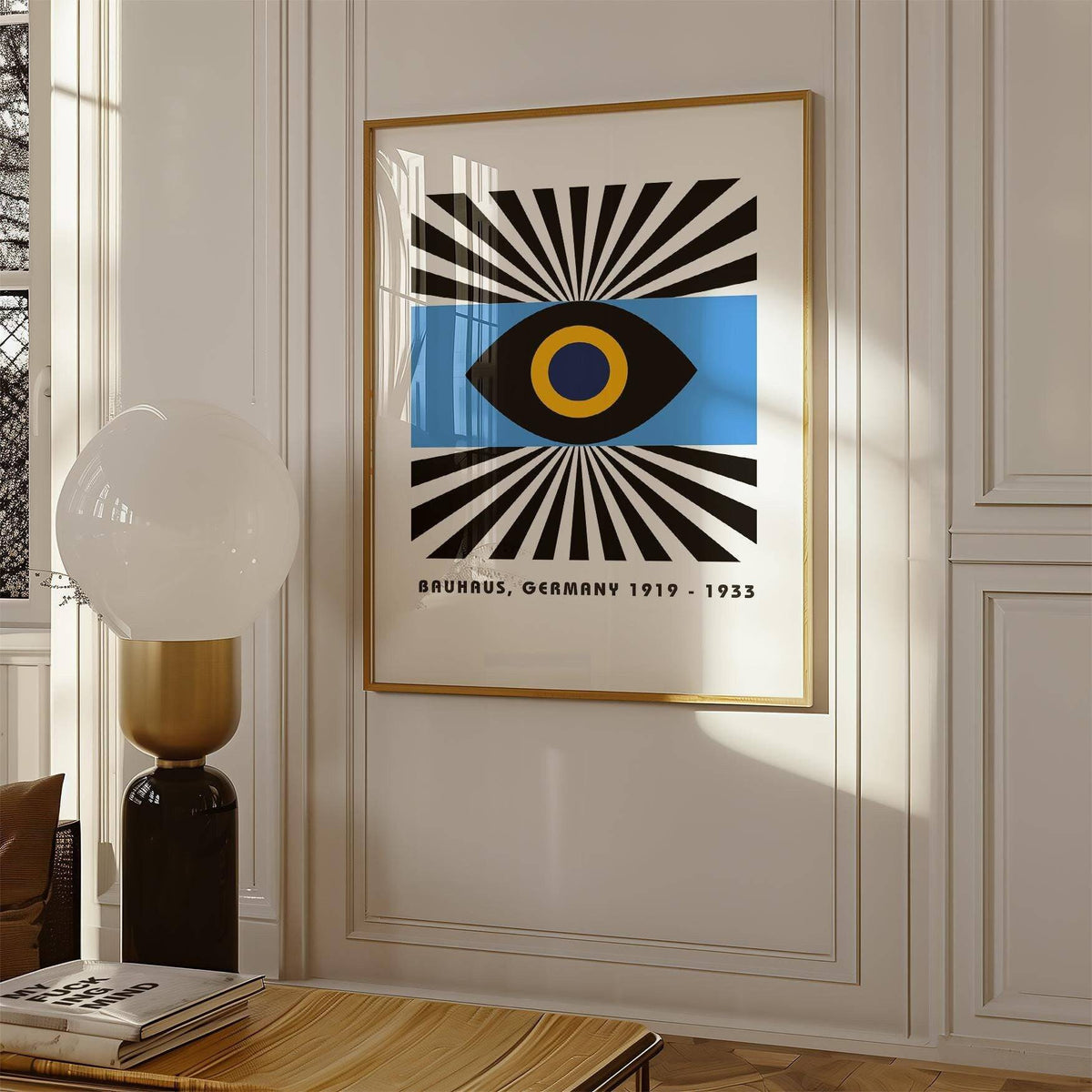 Modern Art Geometric print with abstract eye and black white blue colours in bright room with sculptural lamp