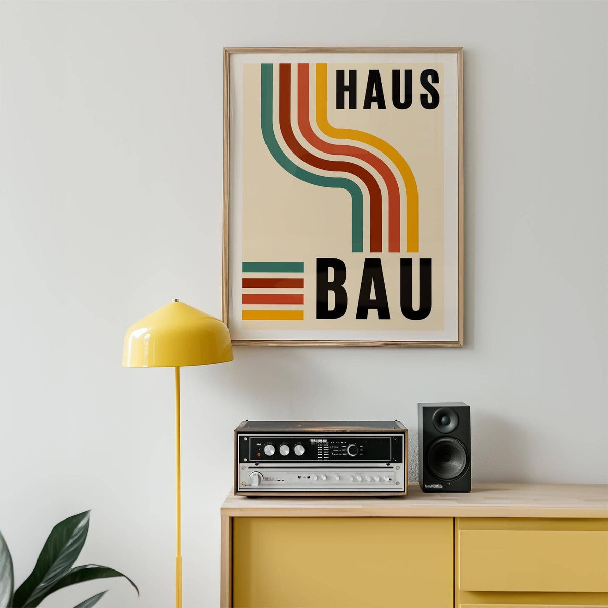 Artwork for the Office with retro curved lines in muted green, orange and yellow above a stereo on a yellow sideboard