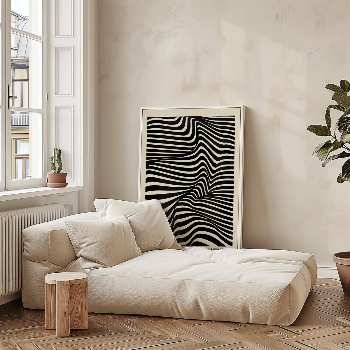 Black minimalist wall art of a black and white optical illusion leaning near a beige sofa in a living room