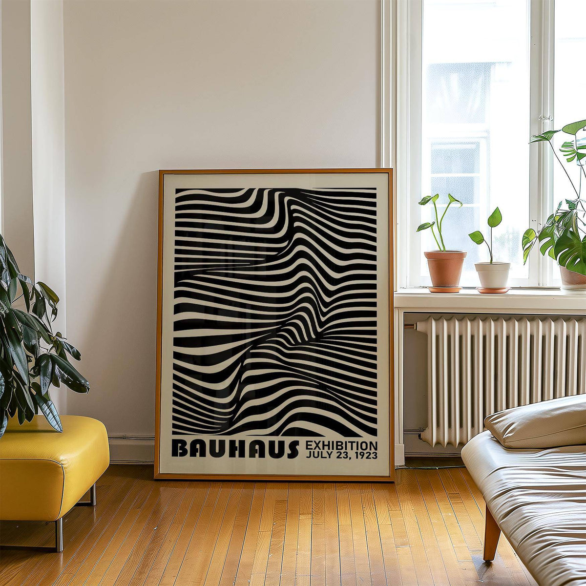 Print leaning on a wooden floor showing a black and white optical illusion with plants on a radiator