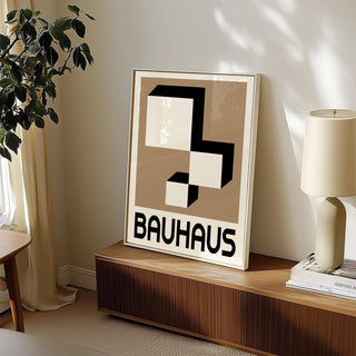 Framed Geometric Wall Hanging leaning on a wooden cabinet with a lamp and plant nearby