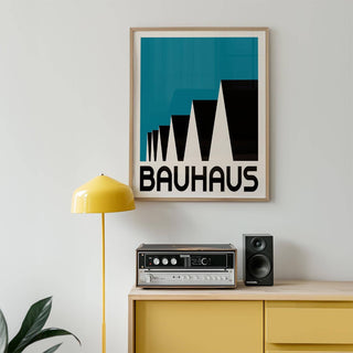 Bauhaus Poster Blue framed print of abstract stepped rooftops in black and blue above a yellow cabinet with a lamp