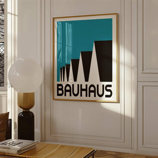 Framed Bauhaus Poster Blue print of abstract stepped rooftops in black and blue on a white wall with a modern lamp