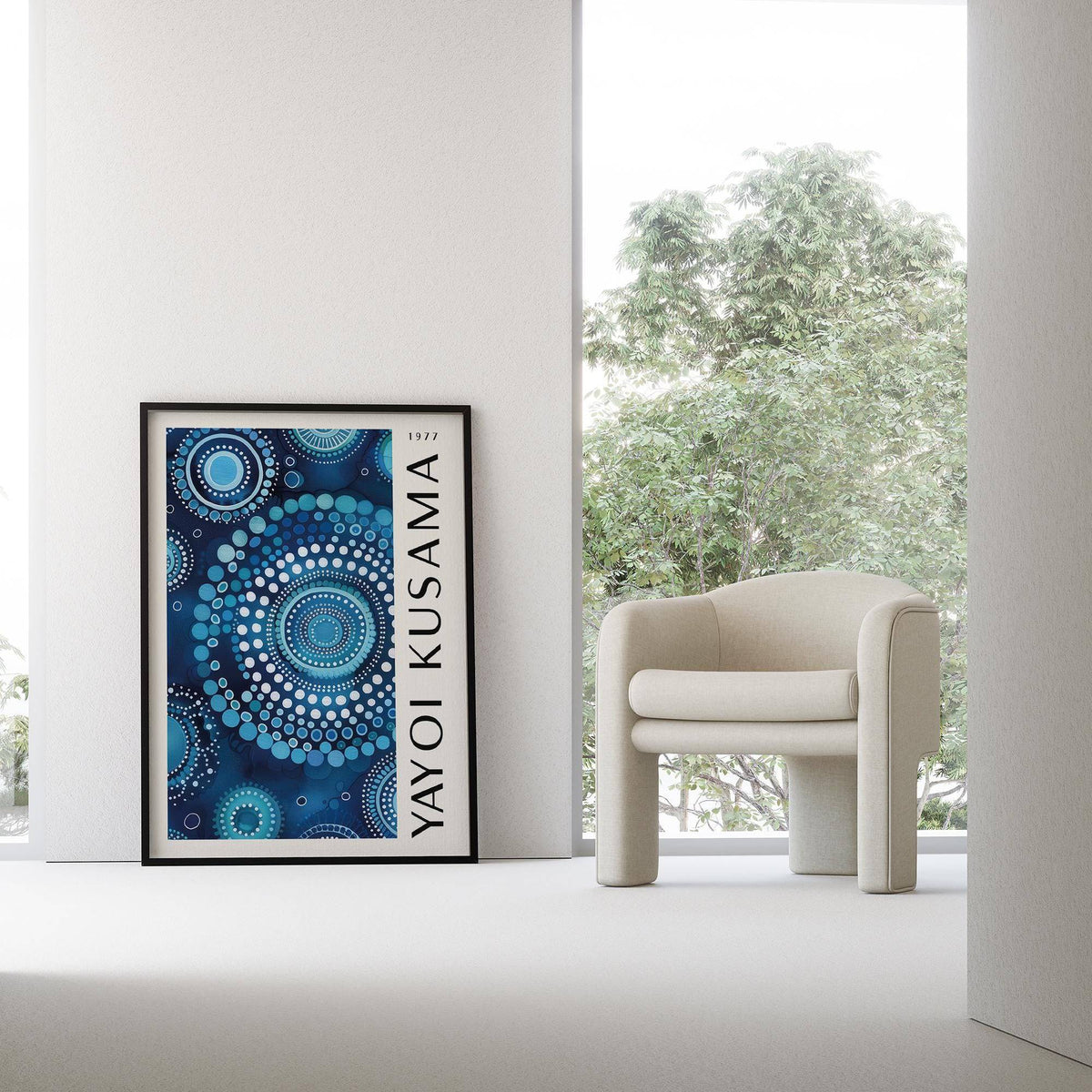 Mandala wall art with blue circular dots leaning against a wall near a cream armchair