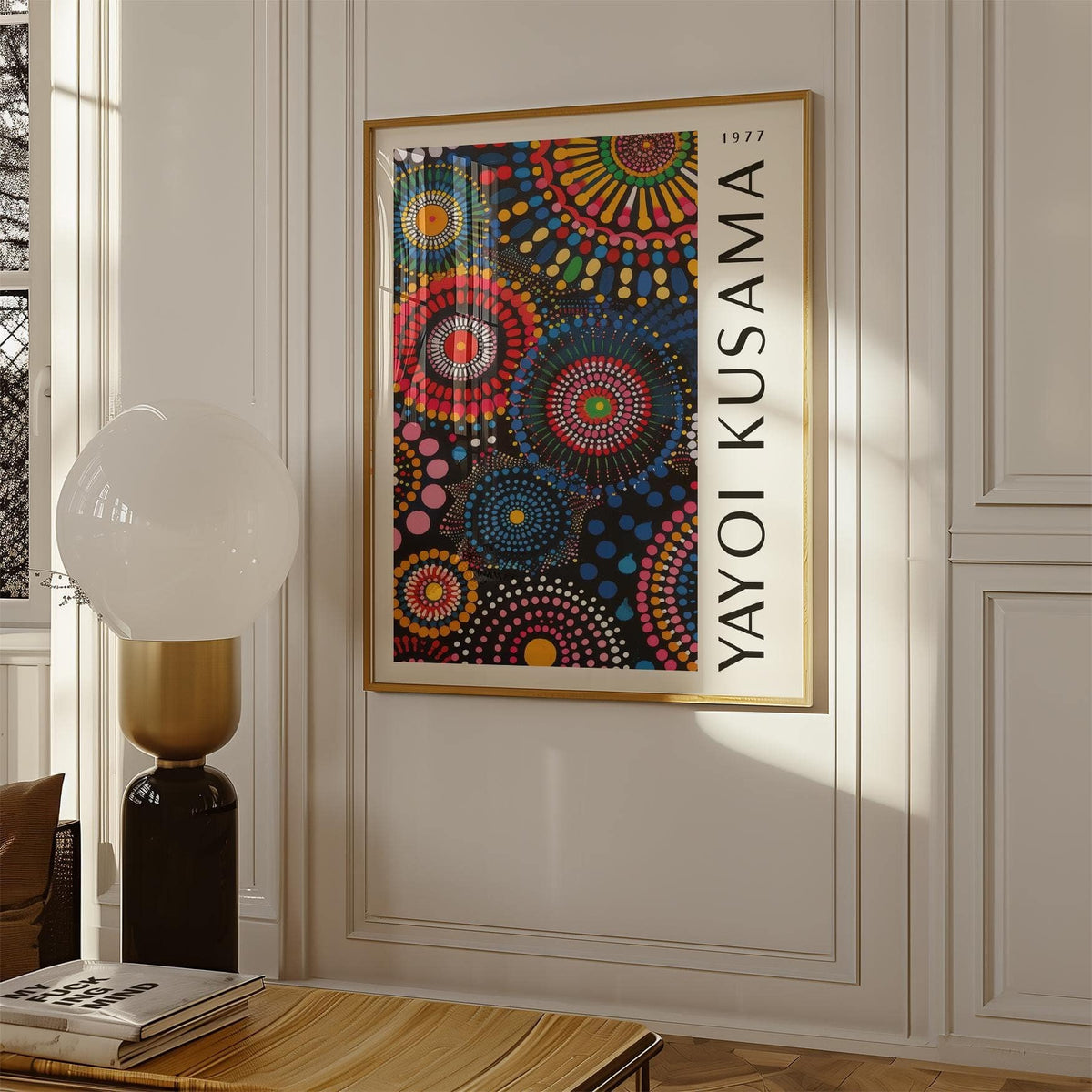 Mandala Art for Wall framed print in gold frame with colourful mandala circles beside a white lamp on a wooden table