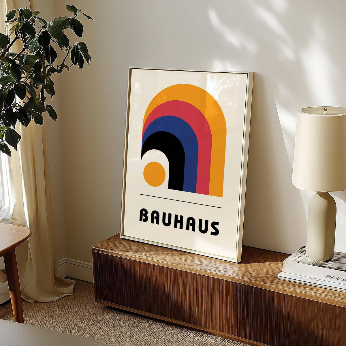 Framed Bauhaus Art Posters print with colourful arches and typographic style on a sideboard