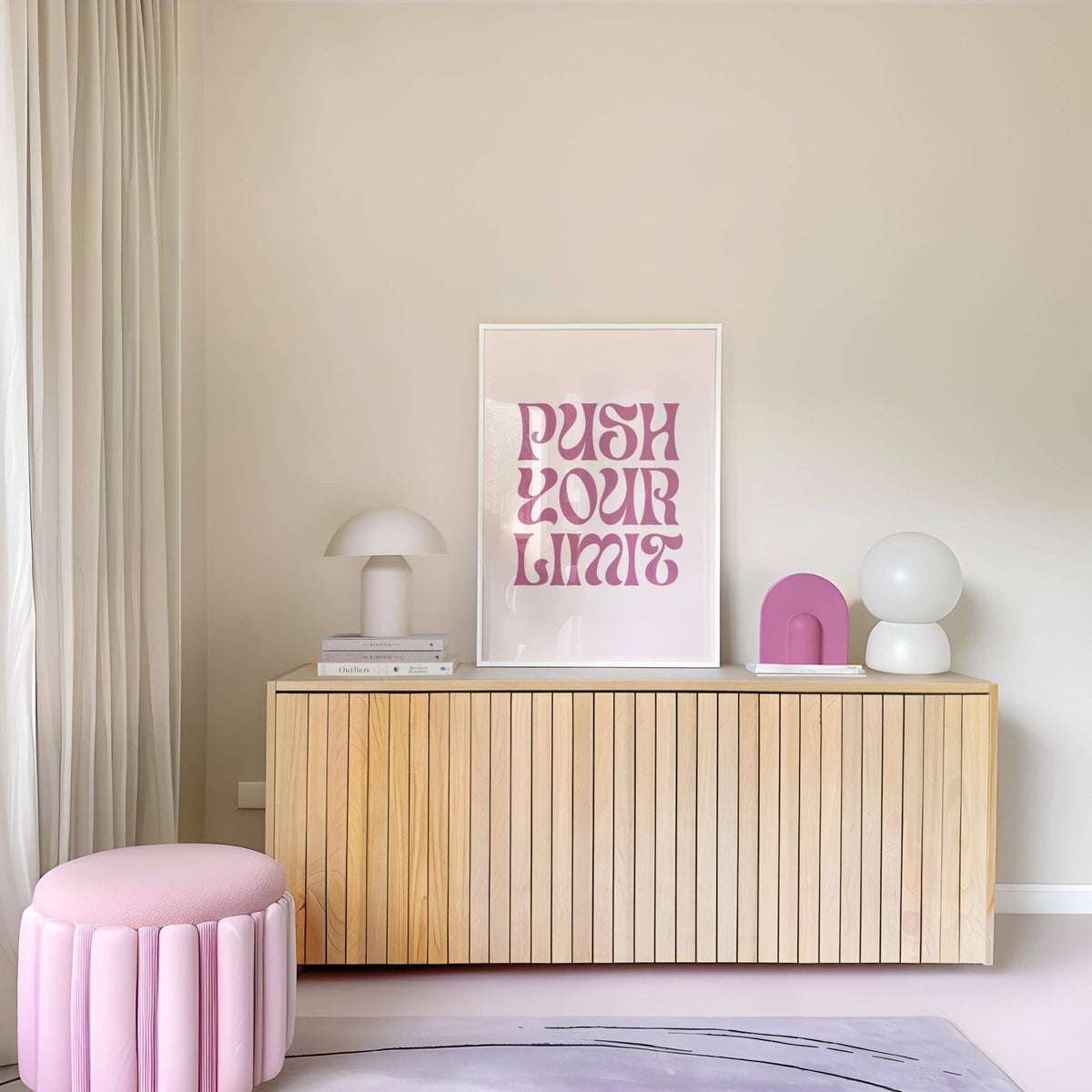 Quote motivational posters print leaning on a wooden sideboard with pastel pink and white objects