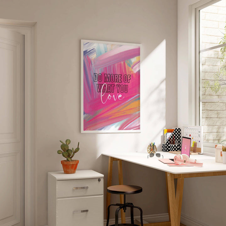 Pink motivational posters wall art with abstract brush strokes and inspirational quote in a work room