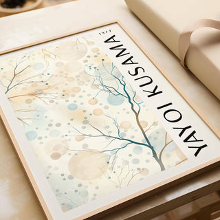 Framed close-up of Nature Prints showing abstract tree branches with beige and blue circles next to wrapping paper