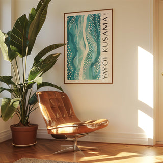 Abstract picture wall art with teal and white patterns above a brown leather chair near a green plant