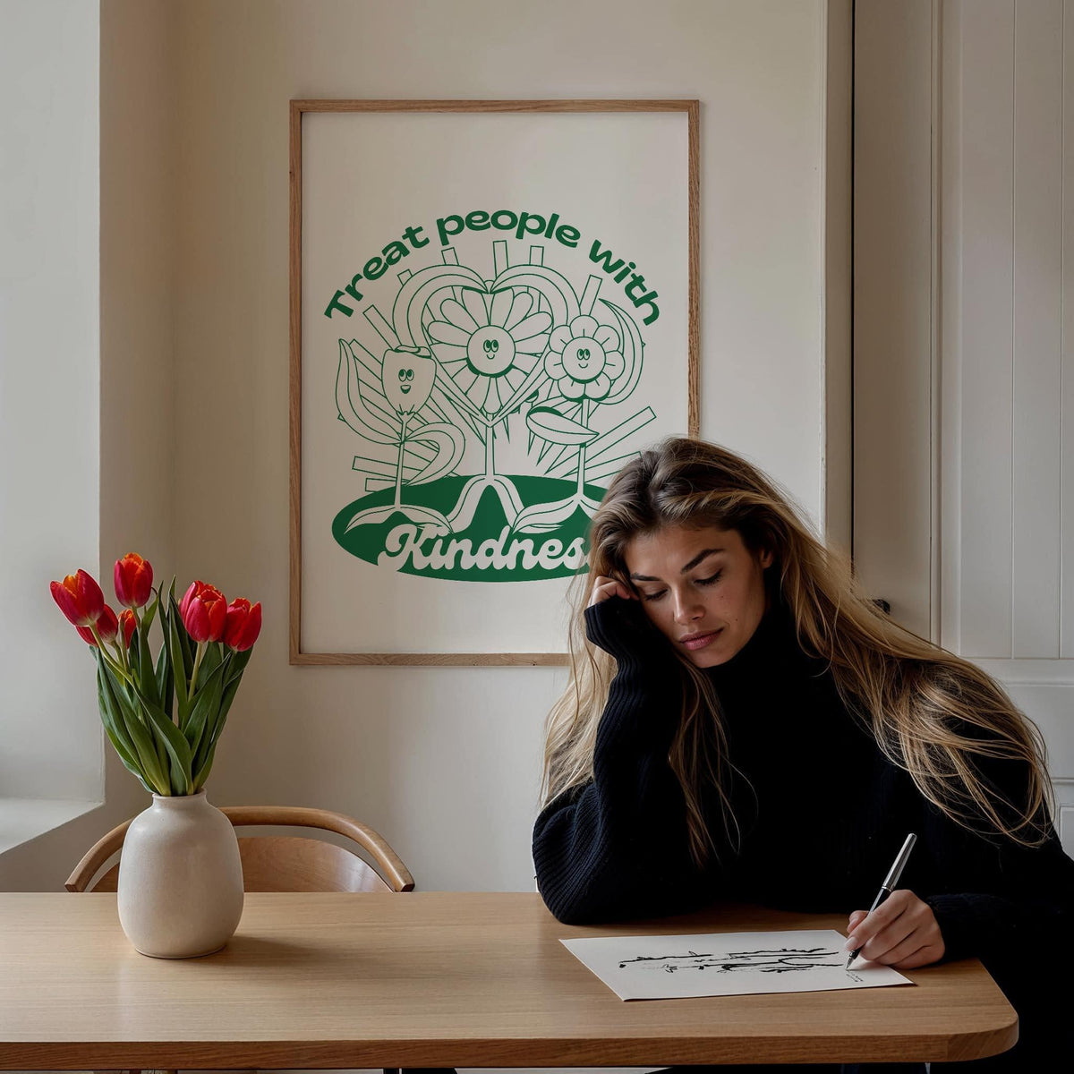 Positive Poster print with smiling flowers and heart in green above a woman drawing with a vase of red tulips