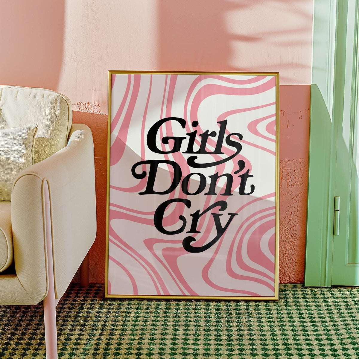 Girls Room Wall Art leaning against a peach wall with pink swirls and black text near a cream sofa leg