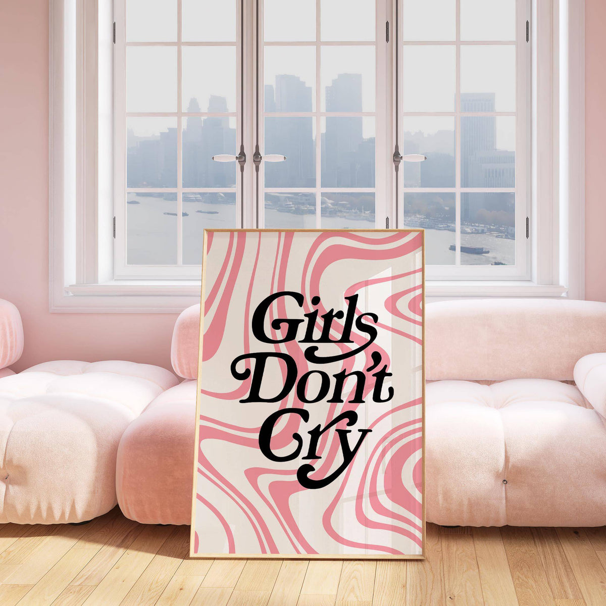 Girls Room Wall Art print leaning on wooden floor with pink swirls and black text in a soft lounge