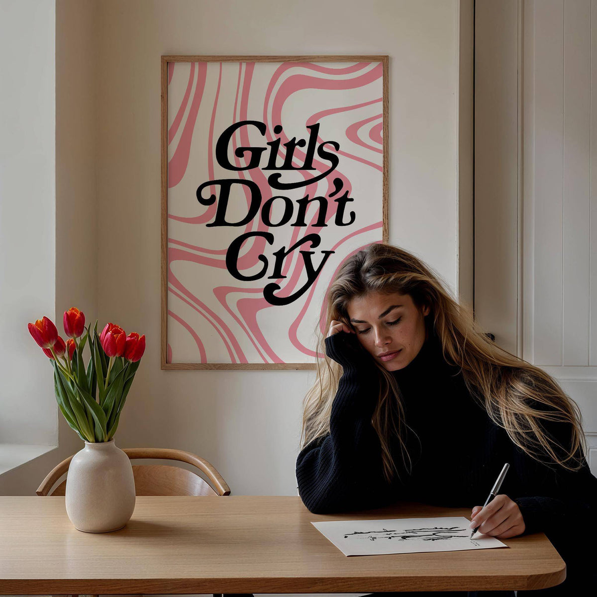 Girls Room Wall Art with a pink and white swirl background above a wooden table with red tulips