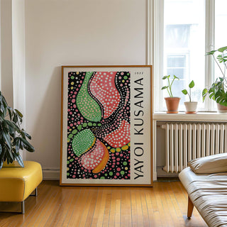 Abstract Shapes wall art print with colourful dotted abstract shapes leaning on a floor near a yellow seat and window plants