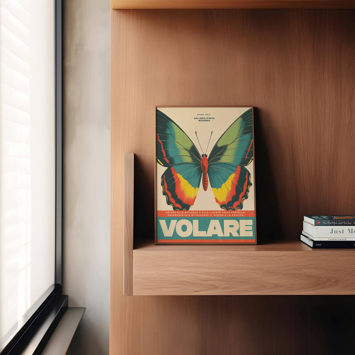 Large Butterfly Wall Art print leaning on a wooden shelf with books nearby