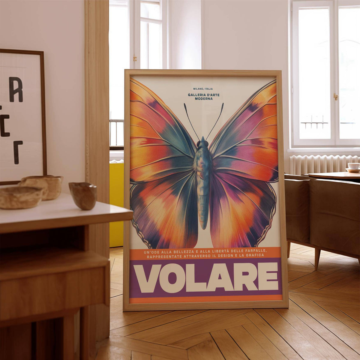 Large Butterfly Print leaning against wall with vibrant colours and purple text in living room with wooden floor
