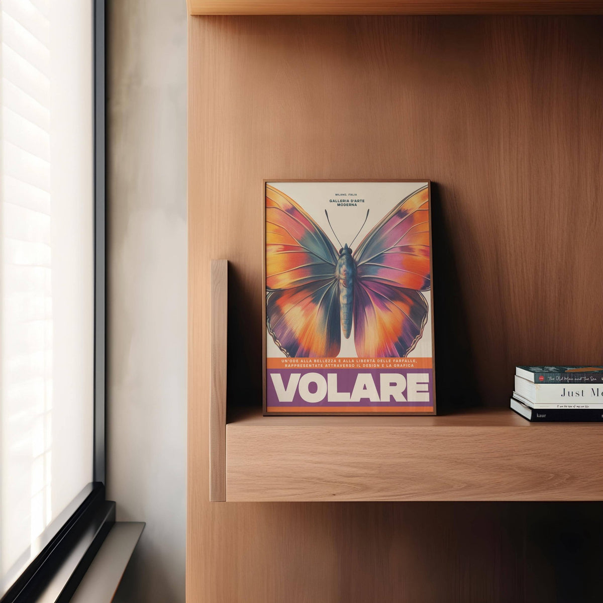 Large Butterfly Print leaning on a wooden shelf with modern books nearby in a softly lit room