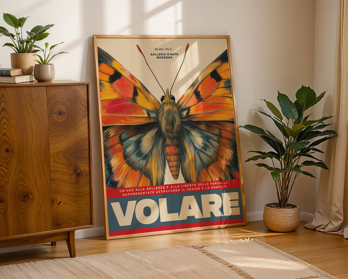 Butterfly art wall print leaning on floor near a green plant and wooden cabinet in sunlight