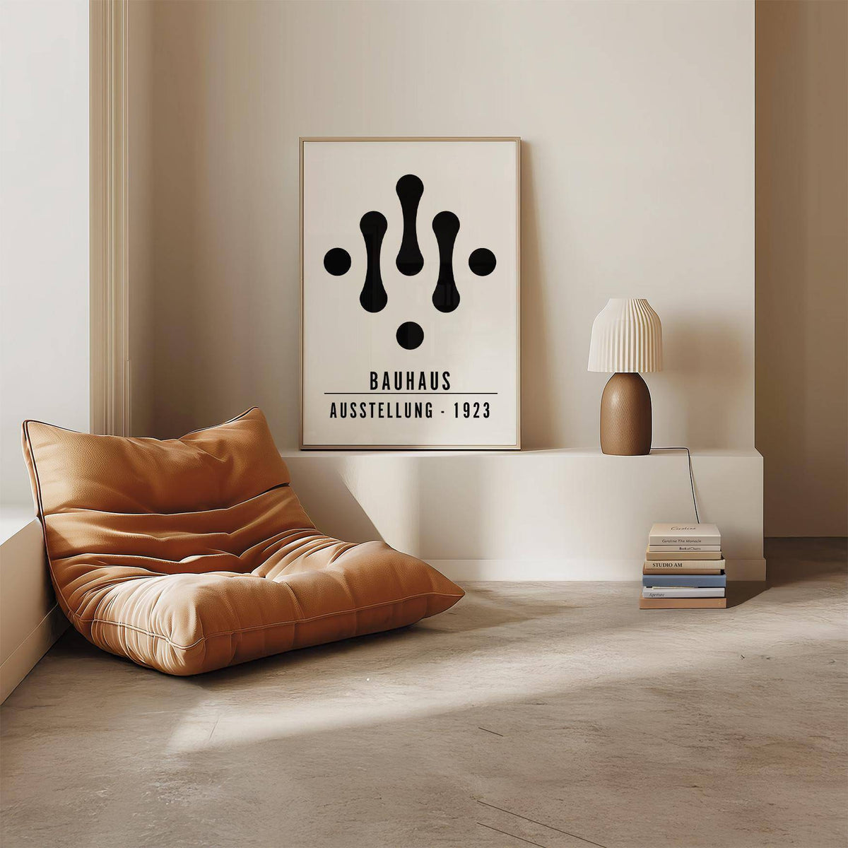 Print leaning on a shelf with Bauhaus art black and white abstract shapes and a brown and white lamp nearby