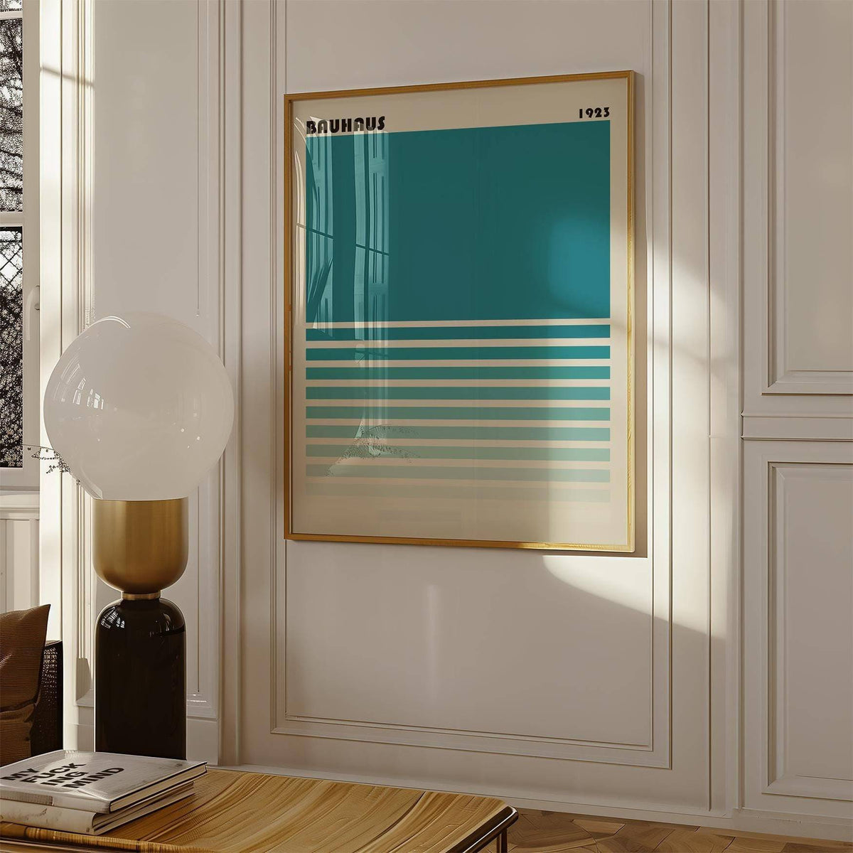 Framed Teal Blue Gradient Wall Art in minimalist bauhaus style on a cream wall with a glass lamp nearby