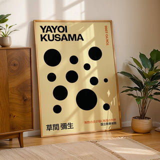 Polka Dot Artwork print leaning against a wall with shadows and a green plant nearby